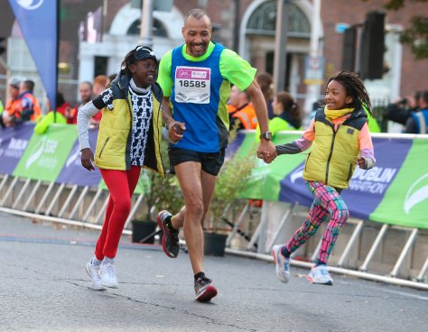 Peter Joseph Singhatey, from Dublin, gets some help at the end. Photos: Damien Eagers